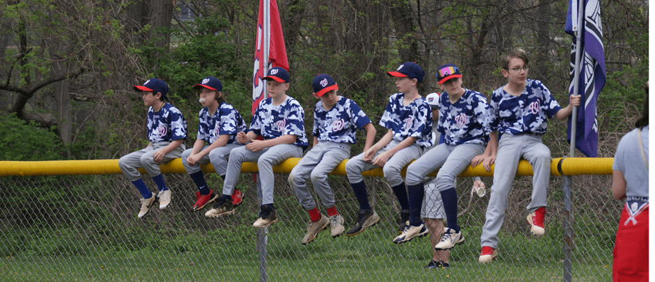 Sitting along the fence at opening day