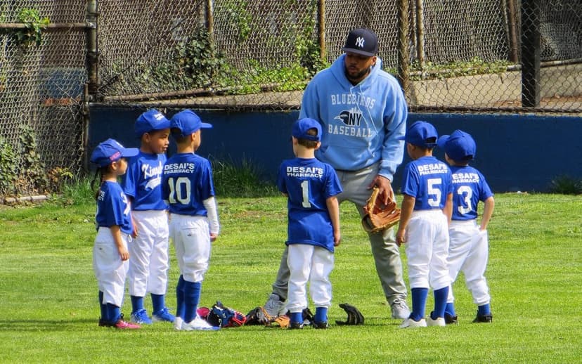 Coach talking to players in a huddle