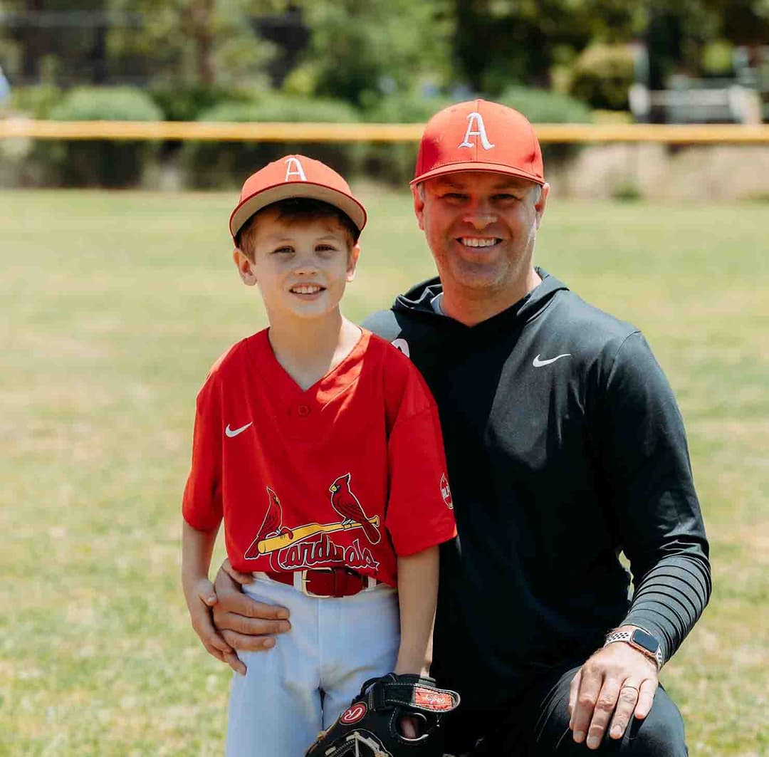 Matt with his son at the baseball field